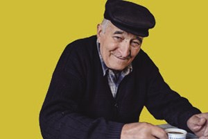 Elderly man drinking tea